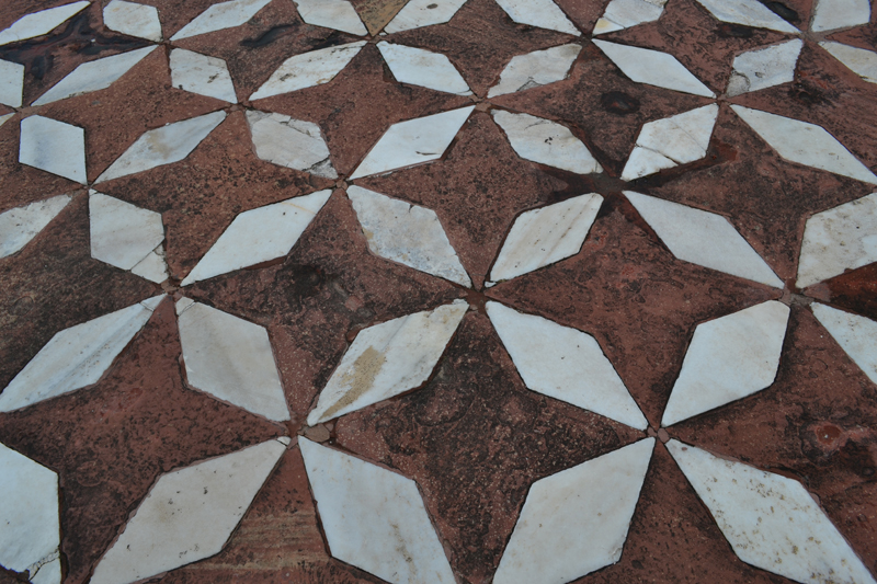 A close up of the pattern on the wall
