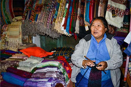 Tibetan scarf seller at Dharmshala, India